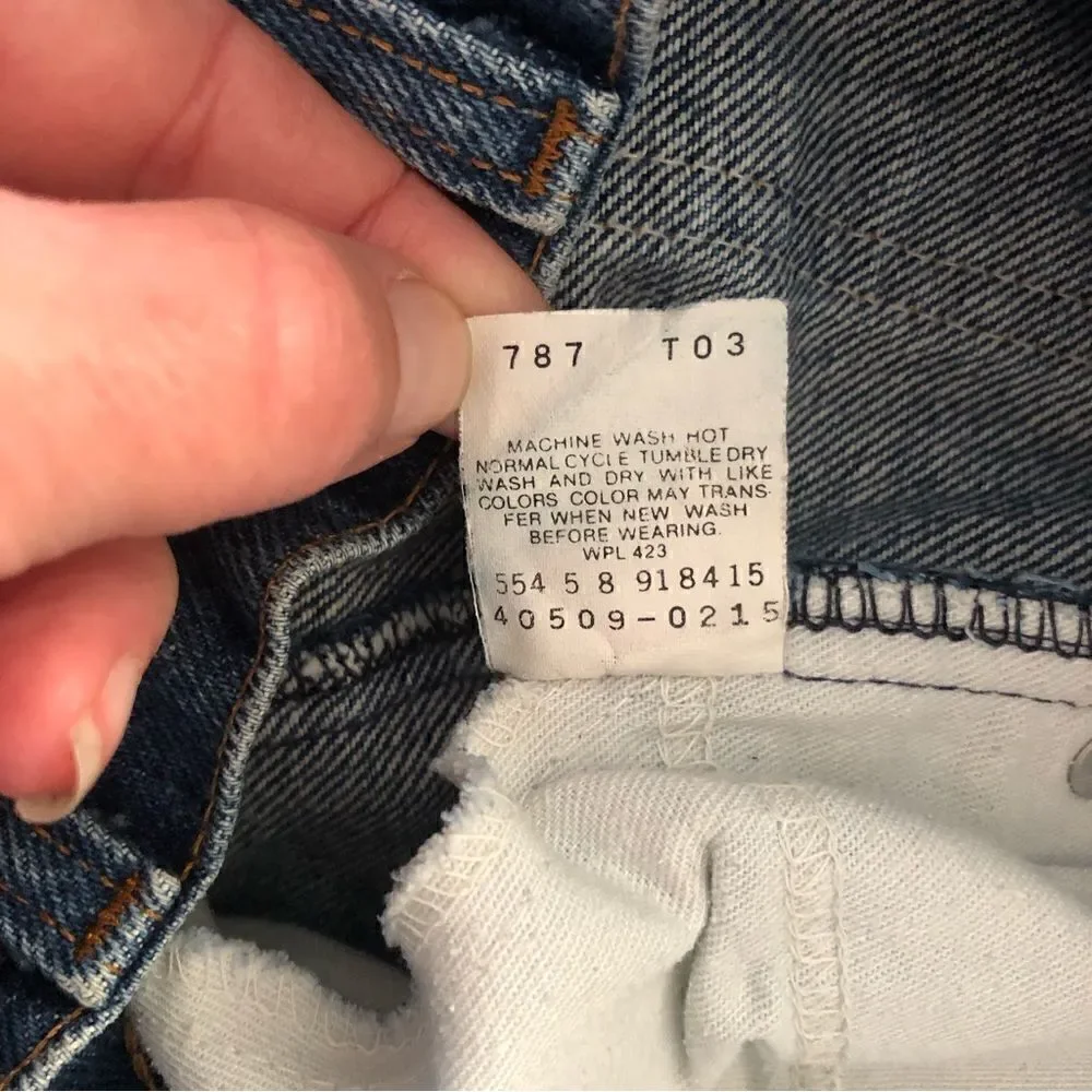 Vintage Levi’s 509 orange tag medium blue wash denim jeans size 33x31